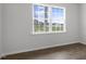 Bedroom with a large window providing ample natural light and views of the outdoors at 129 Pisgah St, Sanford, NC 27330