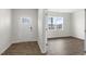 Bright entryway features a white front door with glass panels and dark wood-look floors at 129 Pisgah St, Sanford, NC 27330