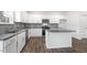 Modern kitchen featuring stainless steel appliances, and granite countertop island at 129 Pisgah St, Sanford, NC 27330