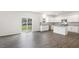 A bright and modern kitchen featuring stainless steel appliances, white cabinets and island at 129 Pisgah St, Sanford, NC 27330