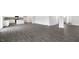 An open-concept living room featuring modern gray wood flooring throughout at 129 Pisgah St, Sanford, NC 27330