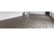 Spacious living room with modern wood-look floors perfect for entertaining guests at 129 Pisgah St, Sanford, NC 27330