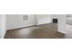 Open living room showcasing modern wood-look floors and a cozy fireplace at 129 Pisgah St, Sanford, NC 27330