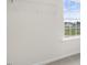 Bright walk-in closet featuring a window and a white wire shelf for optimal storage at 129 Pisgah St, Sanford, NC 27330