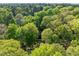 Aerial view of the wooded community offering privacy and a serene setting at 1304 Deboy St, Raleigh, NC 27606
