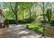 Wooden deck surrounded by mature trees and greenery, providing a relaxing outdoor space at 1304 Deboy St, Raleigh, NC 27606