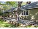 Lovely back deck with built in tree feature, with multiple access points and ample space for relaxing at 1304 Deboy St, Raleigh, NC 27606