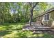 Wooden deck with mature landscaping around the house and lawn at 1304 Deboy St, Raleigh, NC 27606