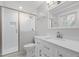 Bathroom featuring new vanity with sink and faucet, toilet, and a shower with glass doors at 1304 Deboy St, Raleigh, NC 27606