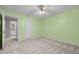 Bedroom with neutral carpet and access to the ensuite bathroom at 1304 Deboy St, Raleigh, NC 27606