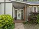 Home front entrance with covered porch, beautiful landscaping, and detailed door with sidelights at 1304 Deboy St, Raleigh, NC 27606
