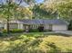 Charming one-story home with a well-maintained lawn and attached two car garage at 1304 Deboy St, Raleigh, NC 27606