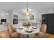 White kitchen with stainless-steel appliances and a breakfast nook with stylish decorations at 1304 Deboy St, Raleigh, NC 27606