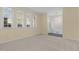 Bright living room featuring carpet, natural light and a view to the home's entrance at 1304 Deboy St, Raleigh, NC 27606