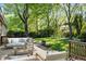 Staged deck featuring furniture, plants, and decor, creating an inviting outdoor living space at 1304 Deboy St, Raleigh, NC 27606