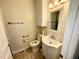 Cozy bathroom with vanity and mirror, complemented by neutral color palette and tile flooring at 1308 Oakridge Ave # 3, Henderson, NC 27536