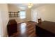 Bedroom with wood floors, ceiling fan, and built-in shelves and an office desk at 1308 Oakridge Ave # 3, Henderson, NC 27536