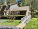 Charming exterior featuring brick and siding, complemented by a well-maintained lawn and accessible ramp at 1308 Oakridge Ave # 3, Henderson, NC 27536