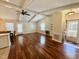 Inviting living area with hardwood floors, fan, and a door leading to the outside at 1308 Oakridge Ave # 3, Henderson, NC 27536