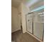 Bright bathroom featuring a glass shower with neutral tile and fixtures at 136 Baneberry Pl, Broadway, NC 27505