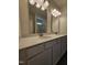 Bathroom featuring a double sink vanity with gray cabinets and quartz countertop at 136 Baneberry Pl, Broadway, NC 27505