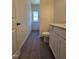 Bright bathroom featuring a vanity with gray cabinets and tile flooring at 136 Baneberry Pl, Broadway, NC 27505