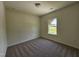Cozy bedroom with plush carpeting, neutral walls, and natural light from window at 136 Baneberry Pl, Broadway, NC 27505