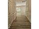 Hallway with wood-look floors leading to the living room at 136 Baneberry Pl, Broadway, NC 27505