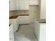 Unfinished kitchen features white cabinets and space for modern appliances at 136 Baneberry Pl, Broadway, NC 27505