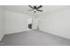 The bright, carpeted bedroom has a ceiling fan and is adjacent to a bathroom at 14 W Bridlewood Trl, Durham, NC 27713