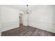 Dining room boasts modern lighting, chair railing and new vinyl floors at 14 W Bridlewood Trl, Durham, NC 27713