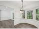 Dining nook features an updated chandelier, new vinyl flooring, and a view to the backyard at 14 W Bridlewood Trl, Durham, NC 27713