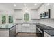 Modern kitchen features stainless appliances, and quartz countertops at 14 W Bridlewood Trl, Durham, NC 27713