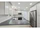 Bright kitchen with stainless appliances, quartz countertops and ample cabinet space at 14 W Bridlewood Trl, Durham, NC 27713