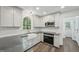 Modern kitchen features stainless appliances, and quartz countertops at 14 W Bridlewood Trl, Durham, NC 27713