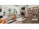 Bright living room features a cozy fireplace, hardwood floors, and tons of natural light at 14 W Bridlewood Trl, Durham, NC 27713