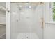 A glass walk-in shower featuring a showerhead and a built-in niche at 14 W Bridlewood Trl, Durham, NC 27713