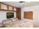 Comfortable bedroom features overhead cabinets and a window with wood blinds at 150 Big Horn Cv, Louisburg, NC 27549
