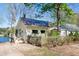 Lakefront cottage with small wooden fence and waterside patio at 150 Big Horn Cv, Louisburg, NC 27549