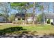 Quaint home with a well-manicured front lawn and mature trees offering shade and privacy at 150 Big Horn Cv, Louisburg, NC 27549