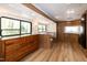 Comfortable living area featuring wood cabinetry, ample storage, and bright windows, creating a warm ambiance at 150 Big Horn Cv, Louisburg, NC 27549
