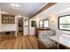 Inviting living area with wood finishes, storage, and a dining nook, enhanced by natural light and open layout at 150 Big Horn Cv, Louisburg, NC 27549
