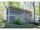 Lovely view of the screened in porch with stairs leading up to the house at 150 Big Horn Cv, Louisburg, NC 27549