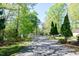 Scenic road lined with trees leads to lakeside recreation area at 150 Big Horn Cv, Louisburg, NC 27549