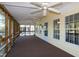 Spacious screened porch with ceiling fans, carpeting, and lake views at 150 Big Horn Cv, Louisburg, NC 27549