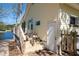 Side of house with steps and a lake view, along with visible house number at 150 Big Horn Cv, Louisburg, NC 27549