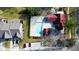 A stunning aerial view of a community pool, clubhouse, and parking area, surrounded by mature landscaping and neighborhood homes at 150 Red Admiral Ct, Hillsborough, NC 27278