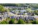 Community aerial showcasing pool, pond, and neatly landscaped homes, offering a vibrant, amenity-rich lifestyle at 150 Red Admiral Ct, Hillsborough, NC 27278