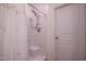 Clean bathroom features a shower with a white shower curtain and a built-in seat at 150 Red Admiral Ct, Hillsborough, NC 27278
