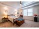 Cozy bedroom features a decorative quilt, tray ceilings, and a window with natural light at 150 Red Admiral Ct, Hillsborough, NC 27278
